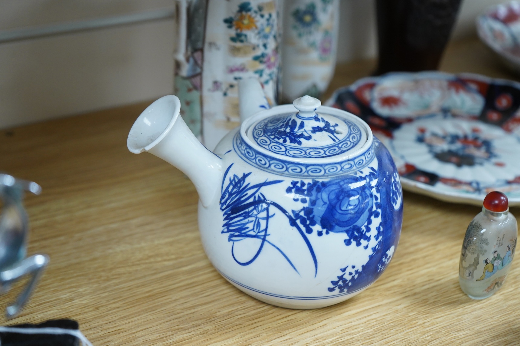 A collection of Asian ceramics to include an inside painted glass snuff bottle, pink ground dish and an Imari dish